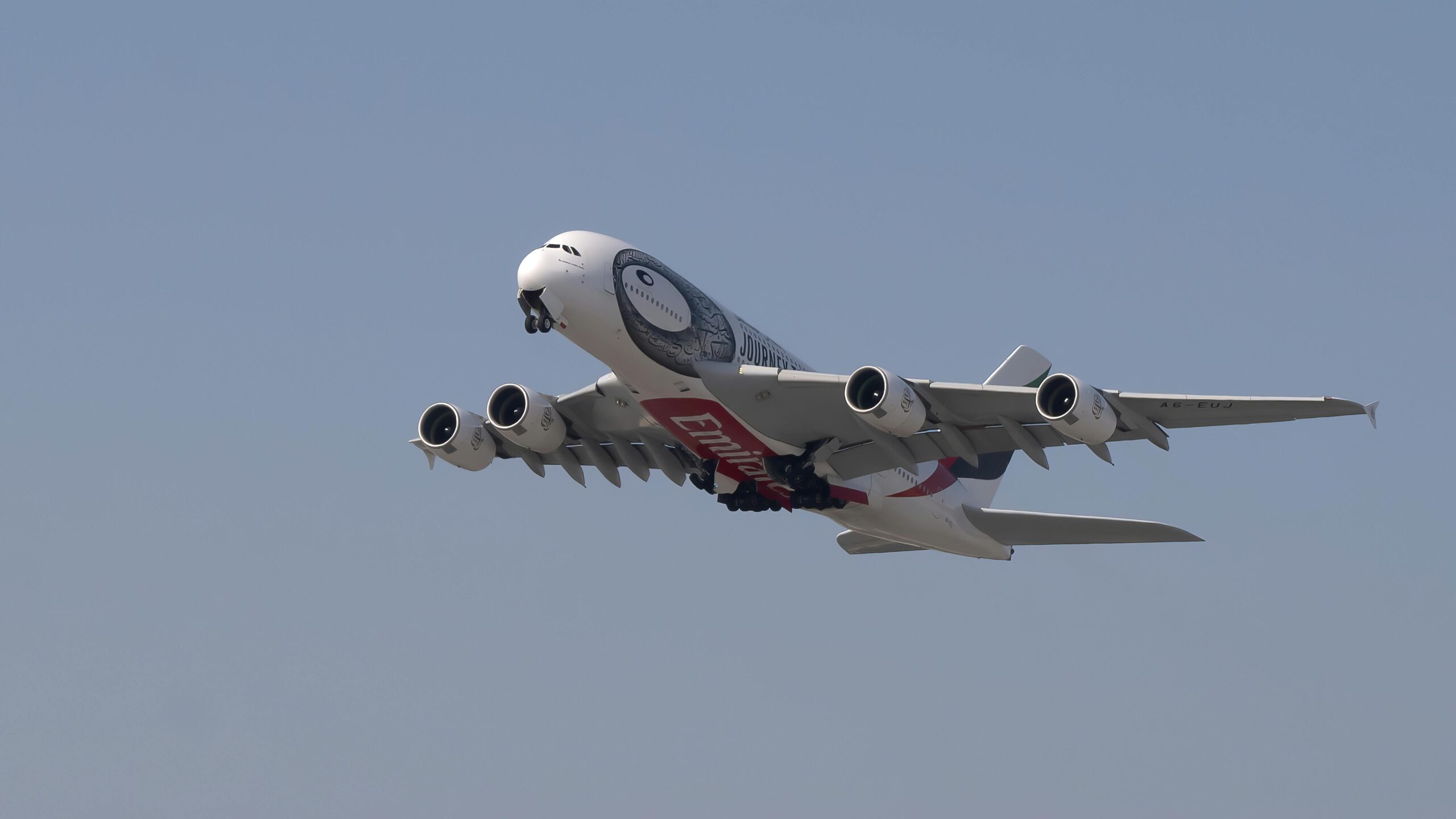 White and Red Airplane in Mid Air