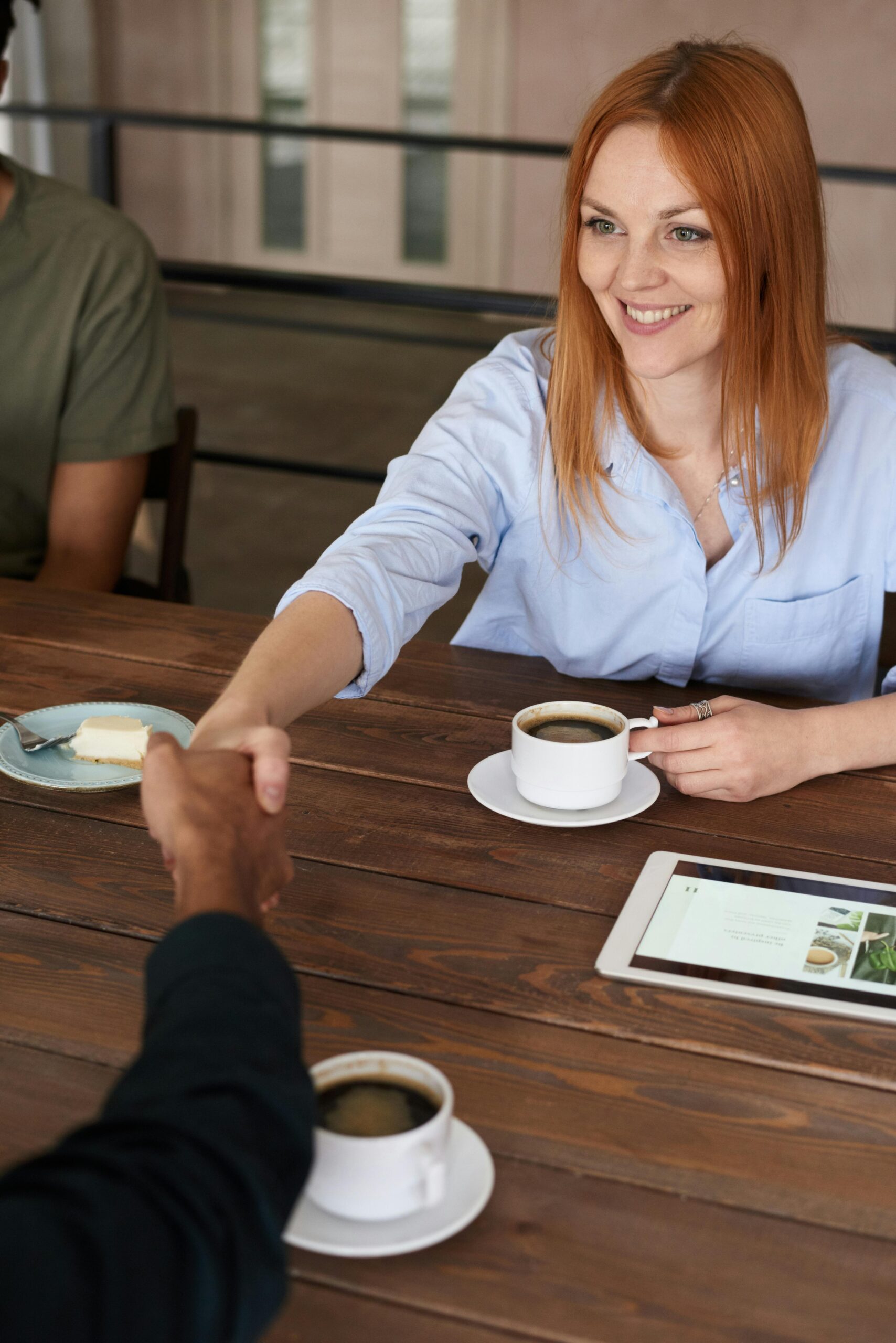 Photo of Woman Handshaking With Another Person