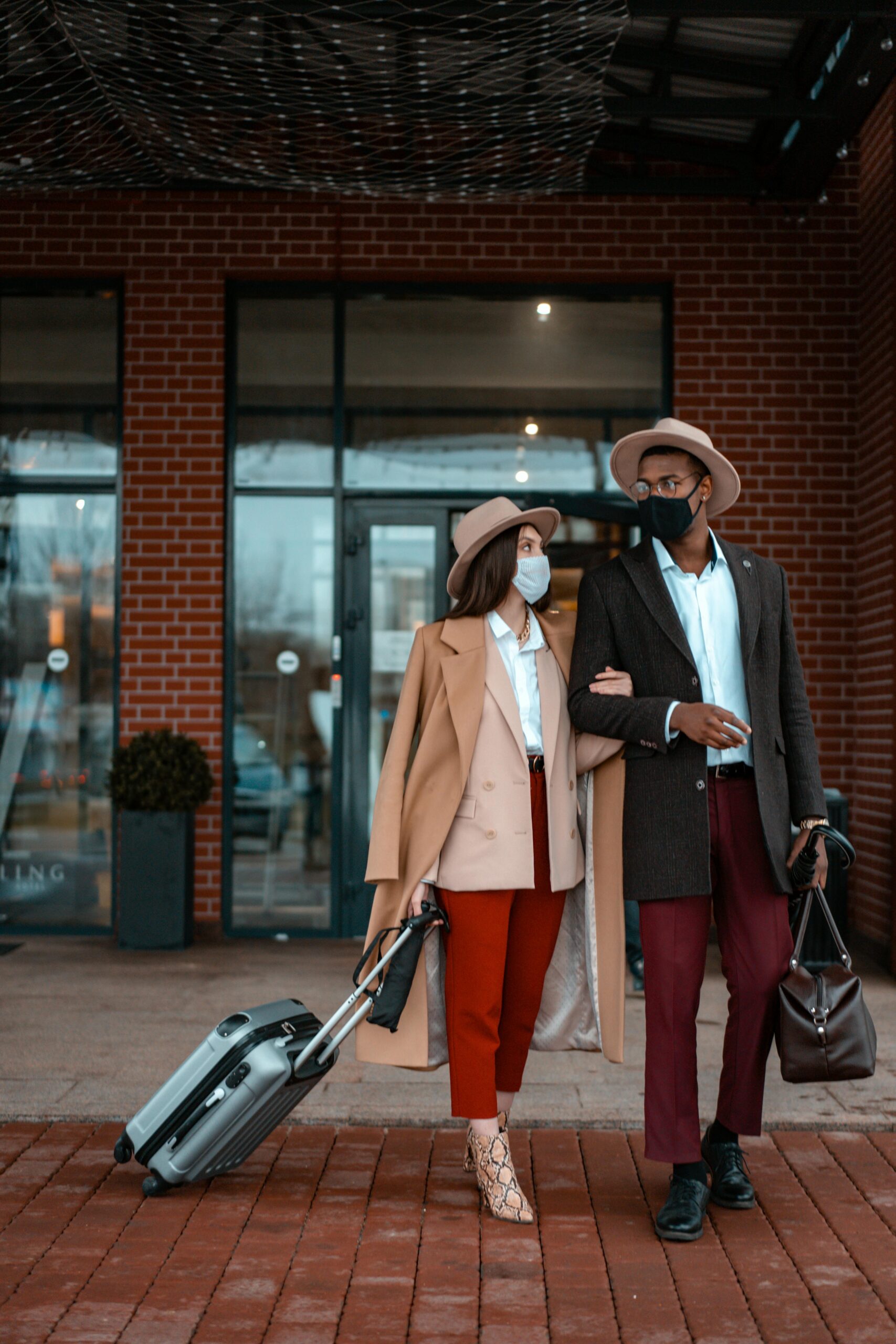 Couple Standing Outside of the Hotel